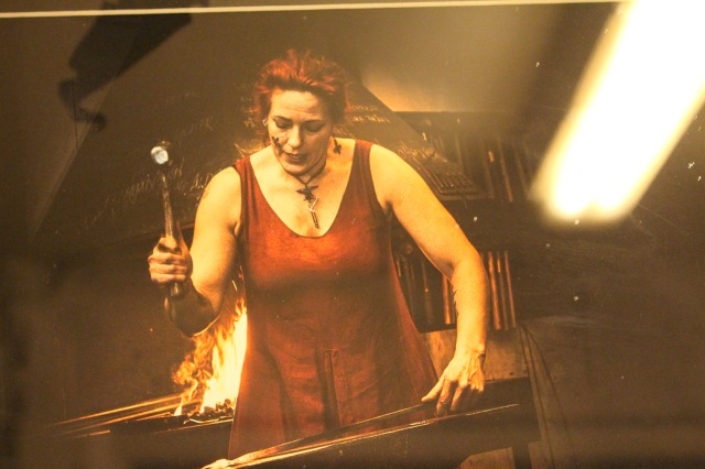 This is a photo of a photo of Therese in action, that is on display in the shop. Therese did embark on a formal education in the art of blacksmithing, but eventually found that the schooling lacked some fundamental elements of what she wanted to learn. She returned home to an apprenticeship with her father, who also was a master blacksmith. 